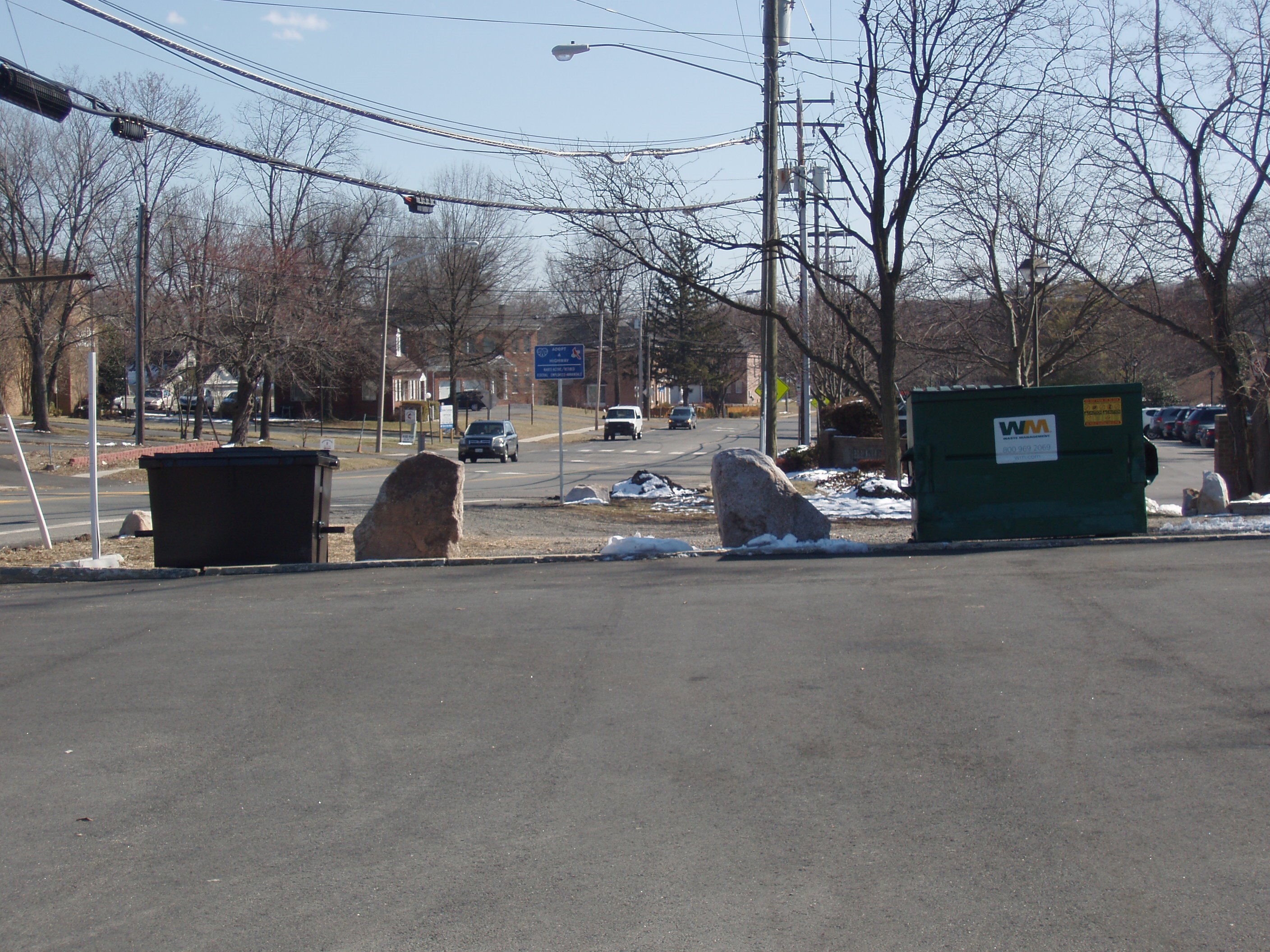 Dumpster and Grease Box in full view of two main streets.  How about taking some pride in this community, and operating within the codes?